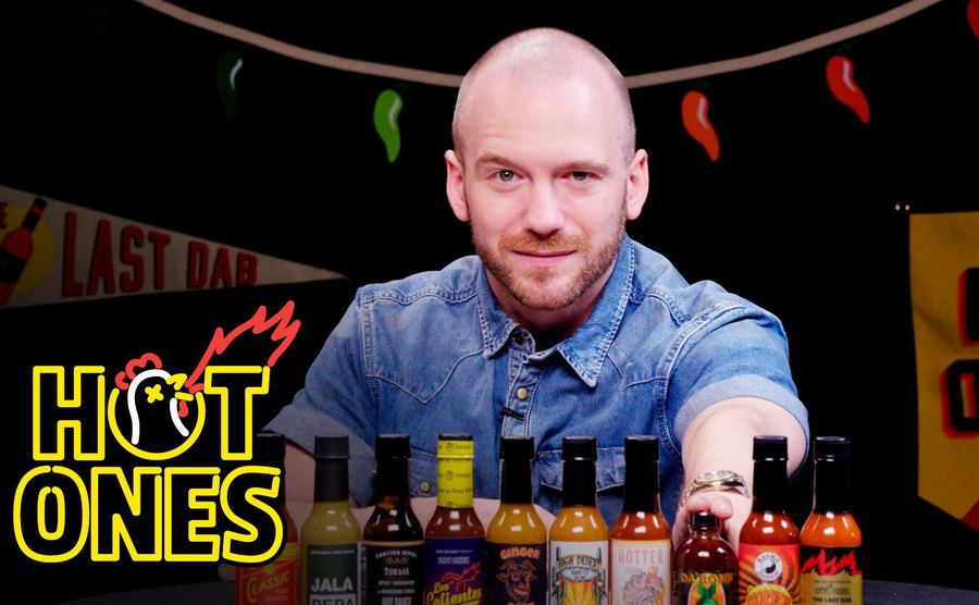A poster of Sean Evans for Hot Ones. 