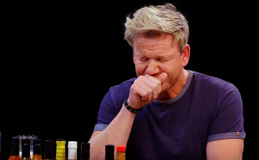 Ramsay is struggling with the spiciness. 