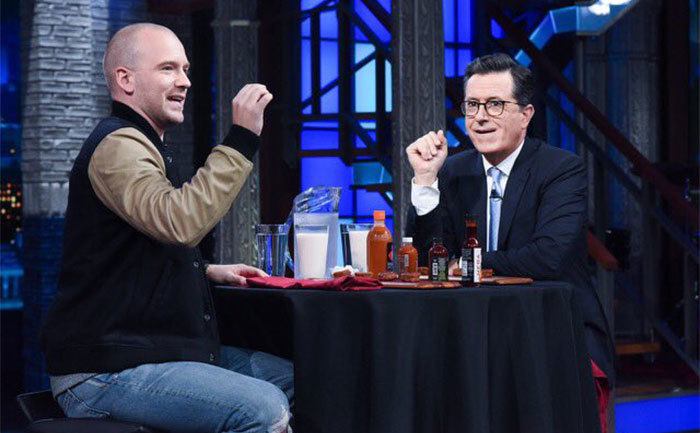 Sean Evans and Stephen Colbert get ready to taste hot wings. 
