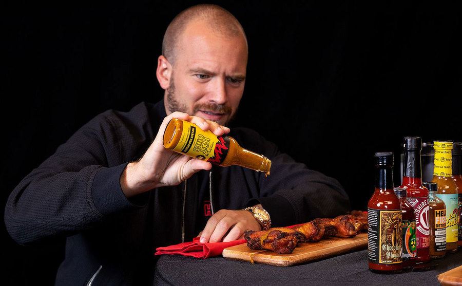 Sean Evens is testing out Hot One's Hot Sauce. 