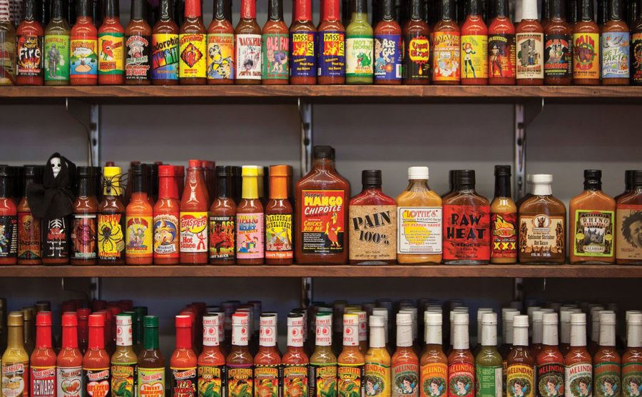 A hot sauce collection on display. 