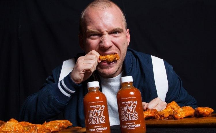 Evans in an ad for Hot One's hot sauce. 