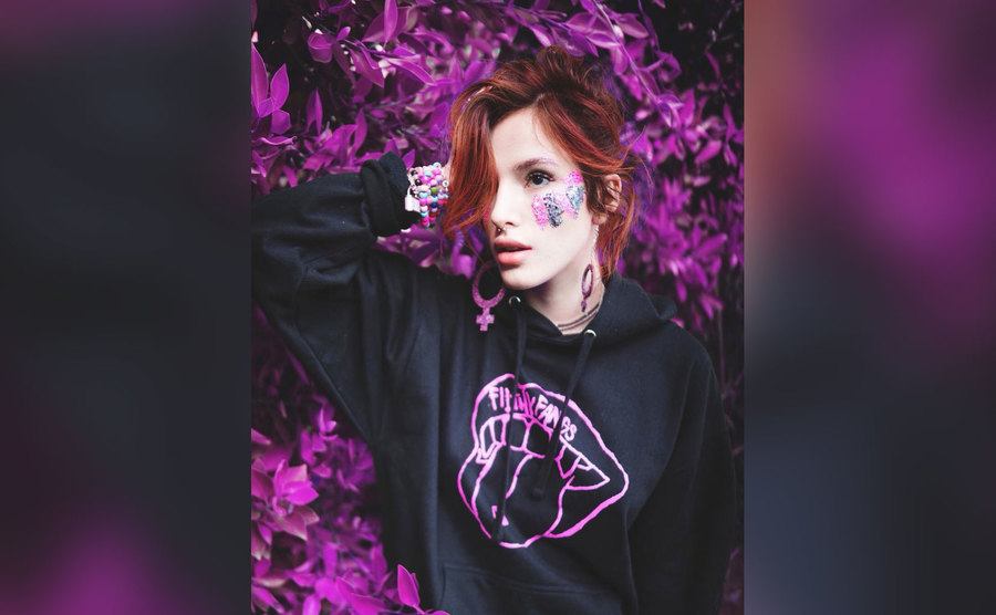 Bella poses in a Filthy Fangs hoodie.