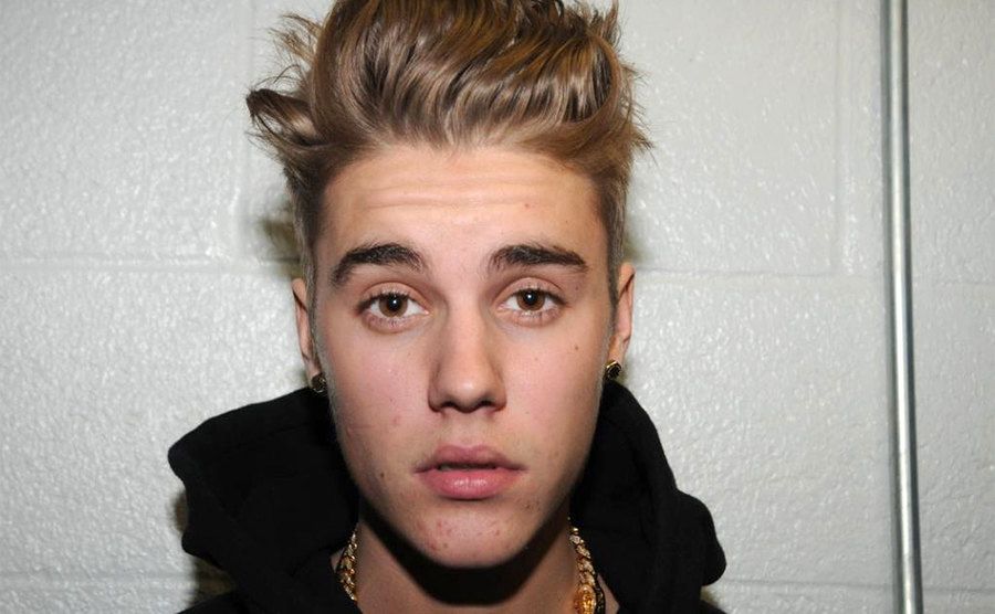 Justin Bieber is photographed by police while in custody.