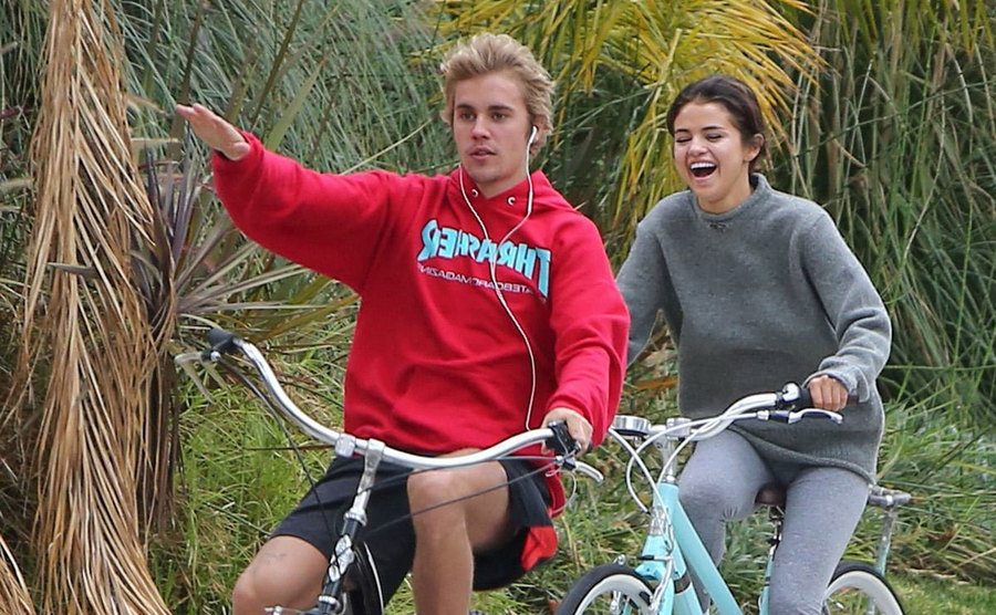 Selena and Justin are seen riding bikes together.