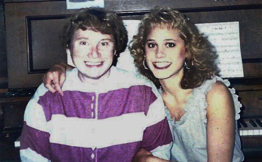 A photo of Mandy hugging her mom as they pose for a picture.