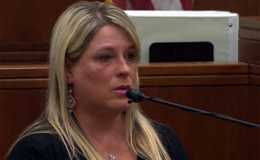 A photo of Gina testifying in court.