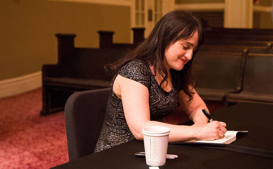 Mara Wilson signs copies of her new book.