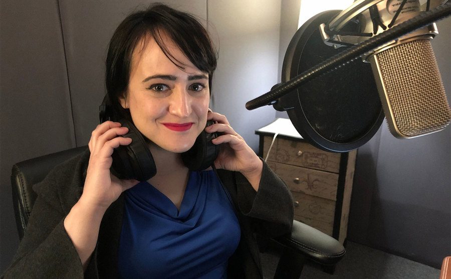 Mara Wilson sits in the recording studio.