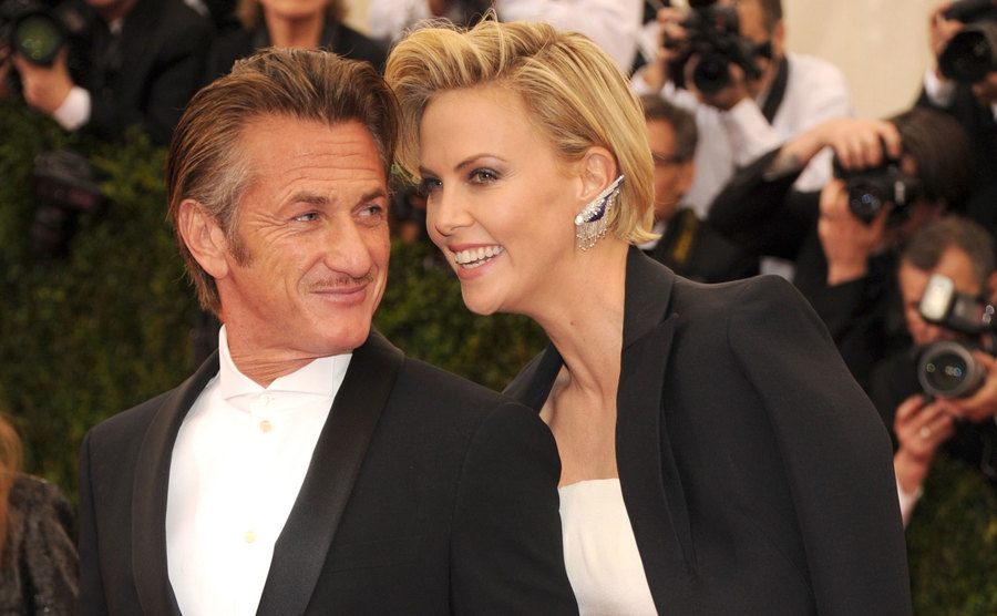 Sean Penn and Charlize Theron pose for the press.