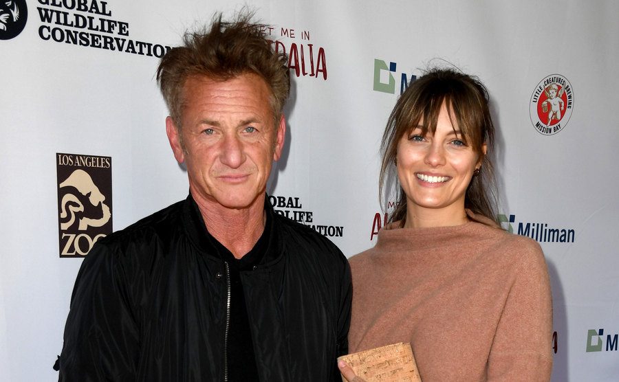 A photo of Sean Penn and Leila George attending an event.