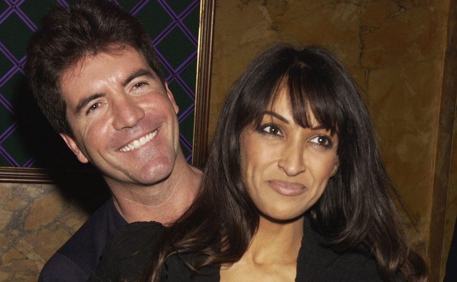 Cowell and Jackie St. Clair pose for the press.