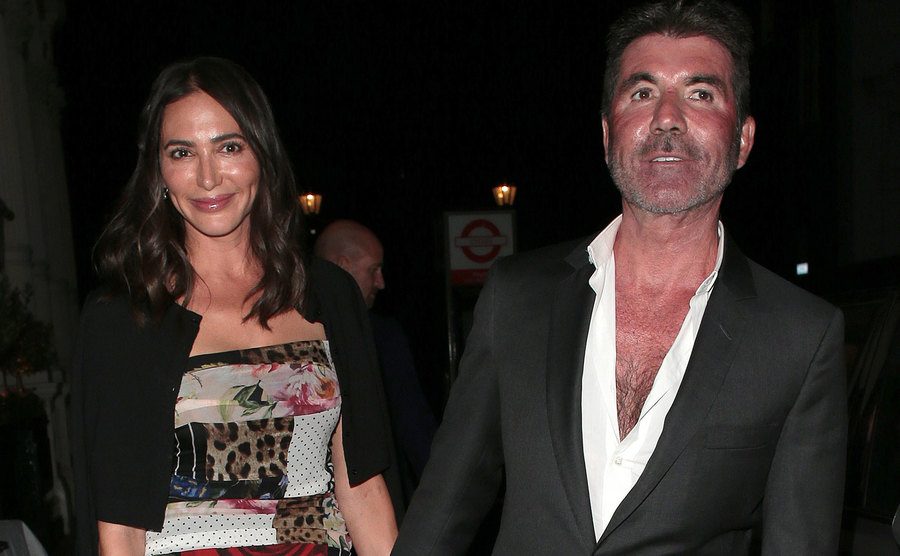 Lauren and Simon walk the street.