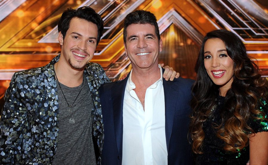 Alex & Sierra pose backstage with Cowell.
