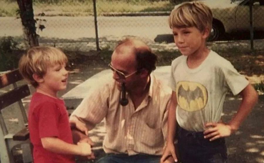 A photo of Casey, and Ben as young boys with their father. 