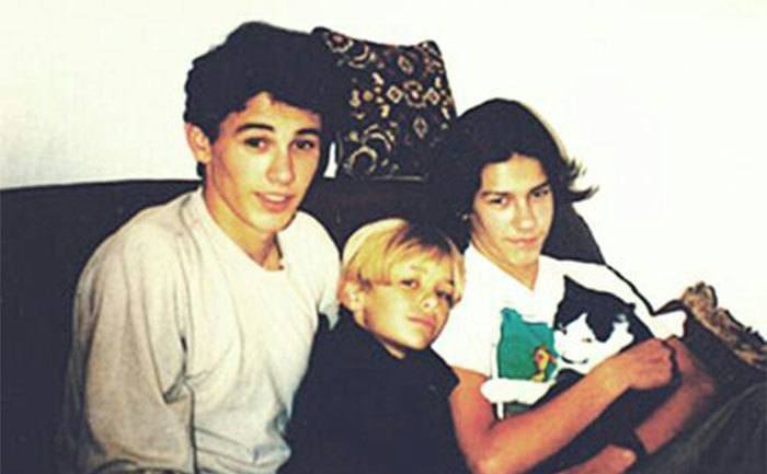 James, Tom, and Dave are sitting on the couch as kids.