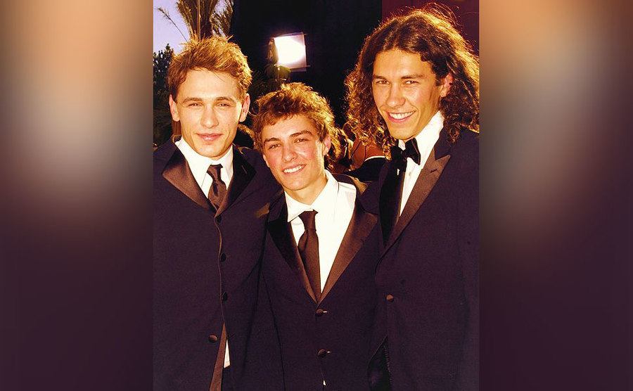 James, Dave, and Tom pose together as they arrive at an event.