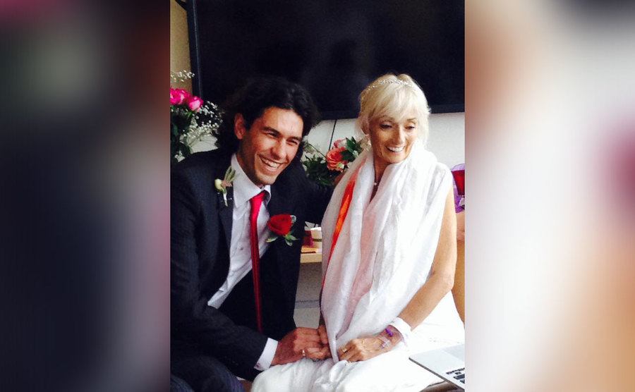 Tom and Julia are laughing on their wedding day.
