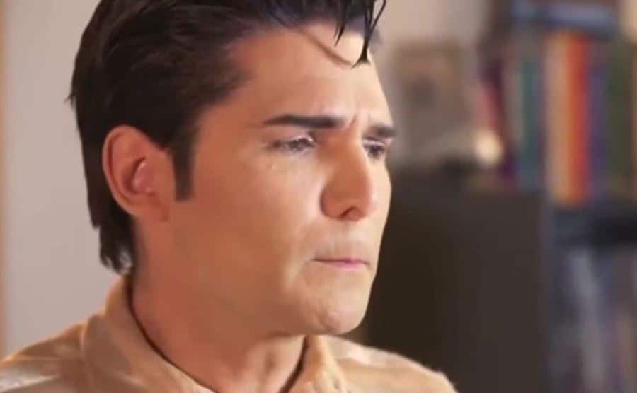 Feldman cries as he speaks in a scene from the documentary film.
