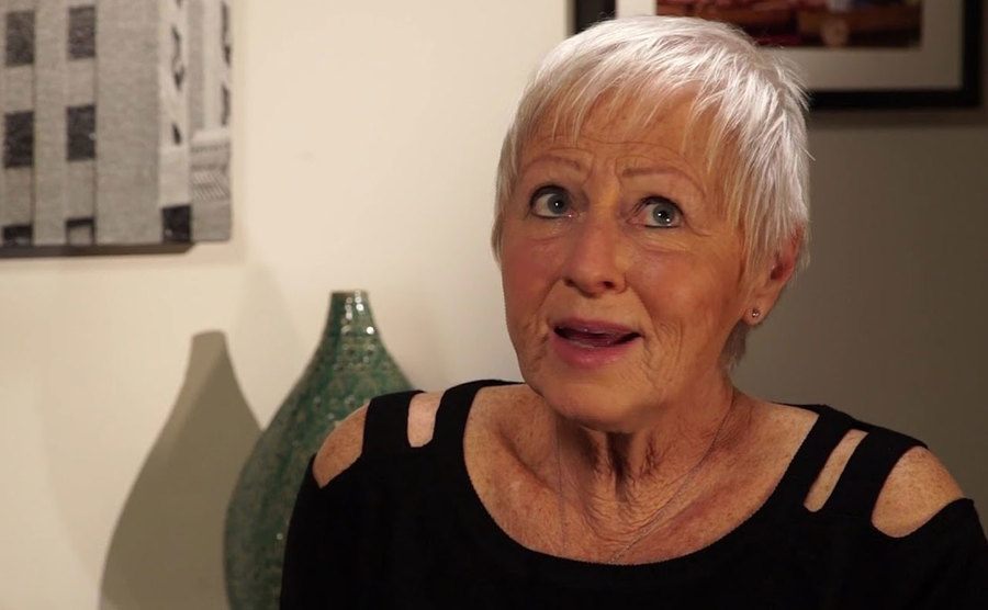 A still of Judy during an interview.
