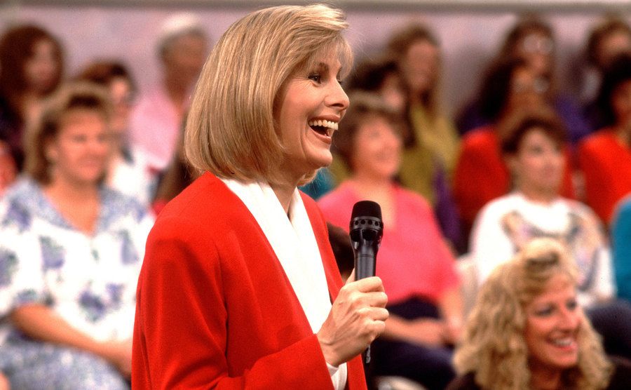 Jenny Jones speaks with members of the audience during her talk show.