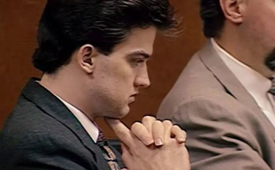A still of Schmitz sitting in court.
