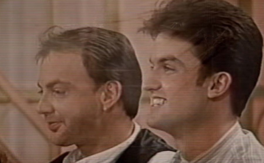 A still of Amedure and Schmitz in the talk show.