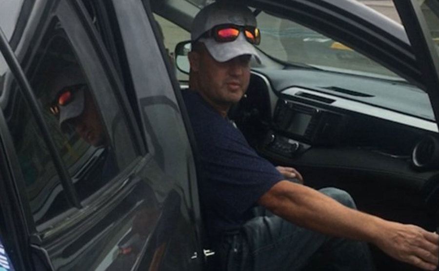 An image of Schmitz sitting in his car.