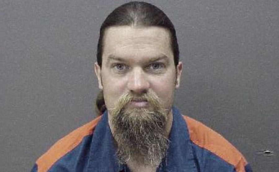 A mugshot of Schmitz.