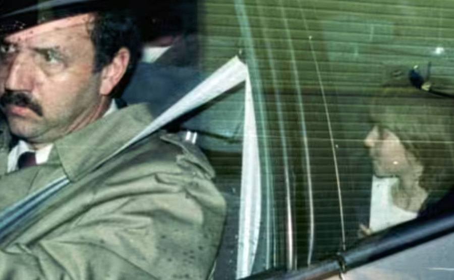 An image of Katie sitting in the backseat of a car.