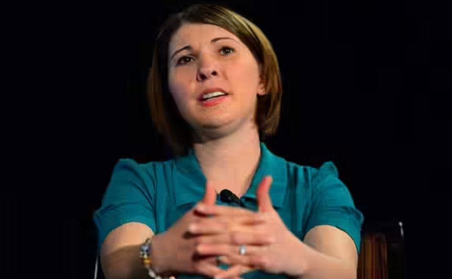 Katie speaks during a conference.
