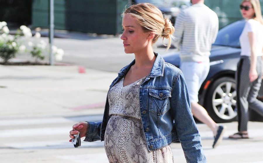 A pregnant Cavallari walks the street.