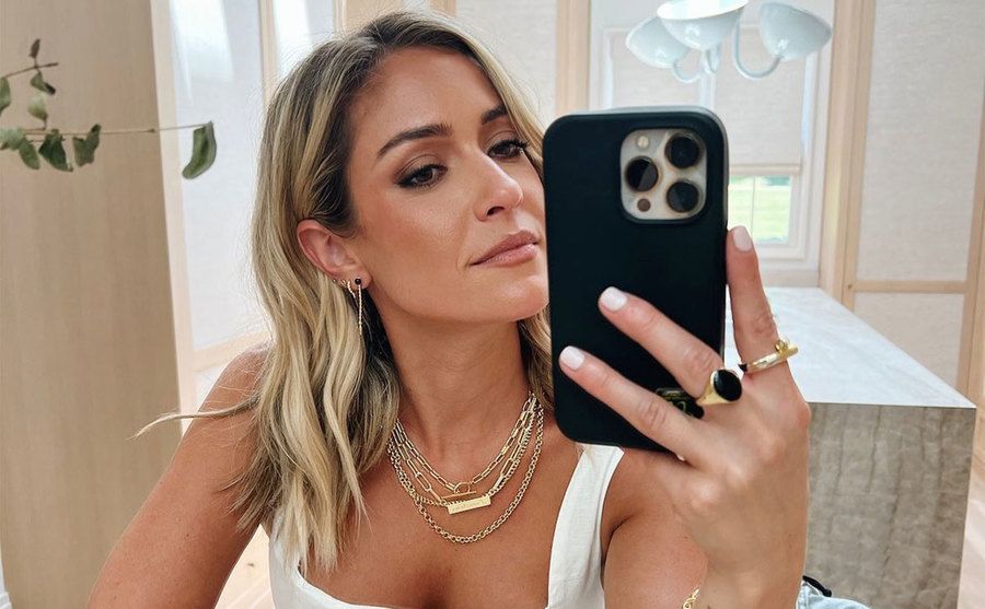 Cavallari takes a picture in front of a mirror.