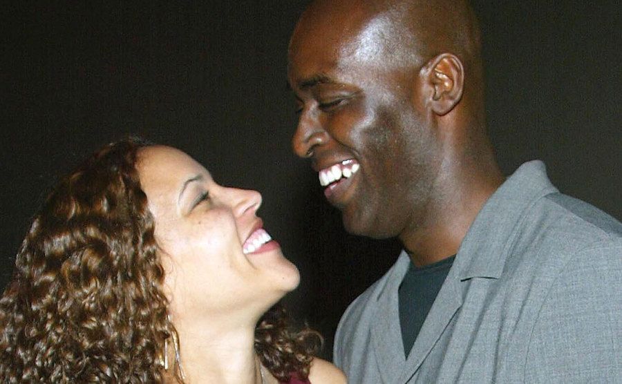 An image of April and Michael smiling at each other.