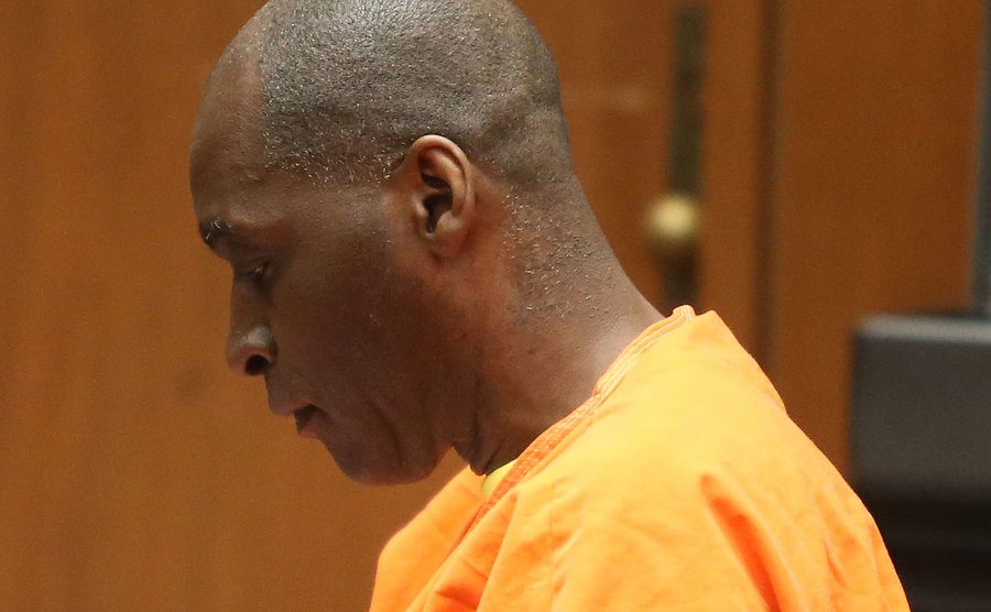 Michael sits in court.