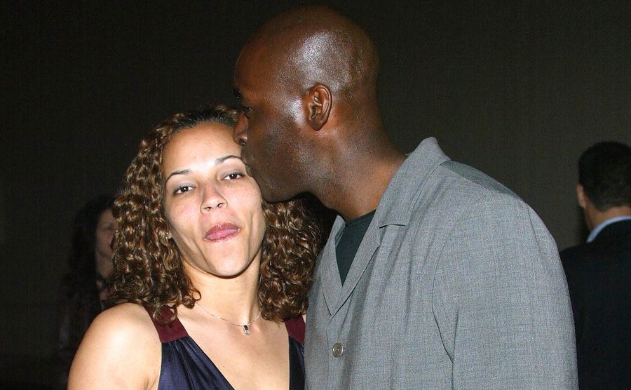 A photo of Michael kissing April on the head.
