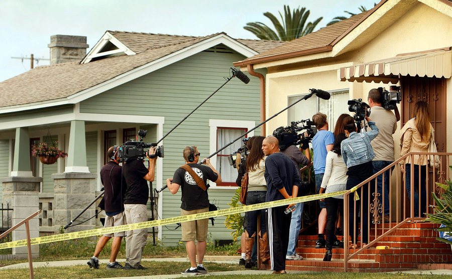 The media stands outside Michael’s home.