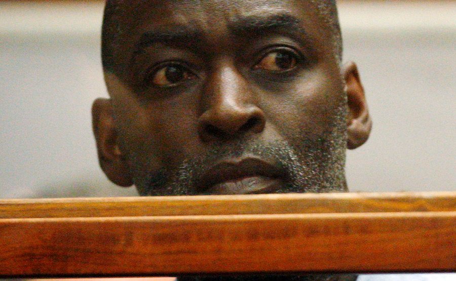Michael stands in court.