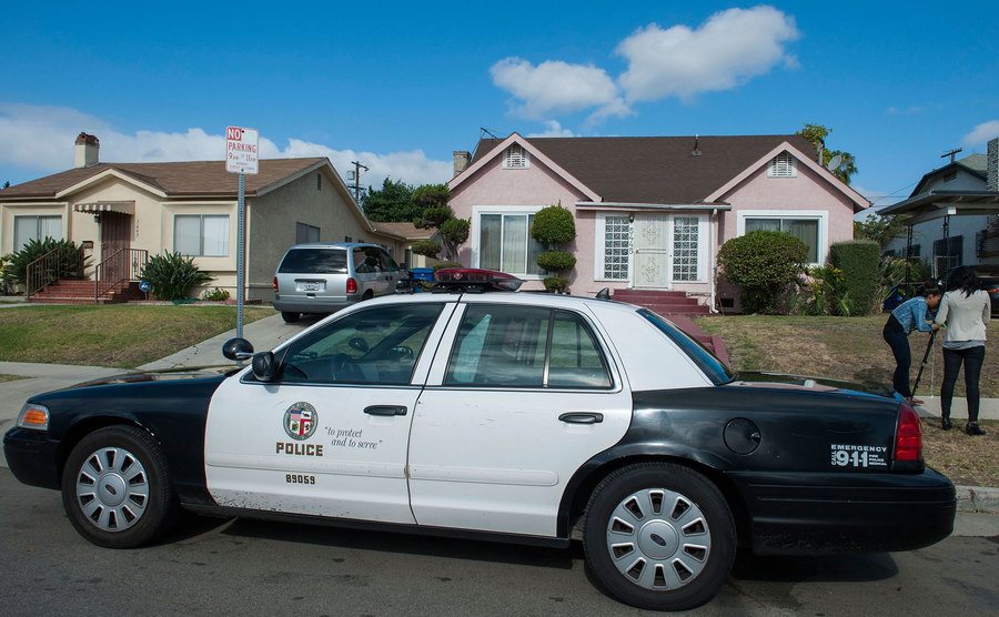 A police car sits parked in front of Michael’s home.