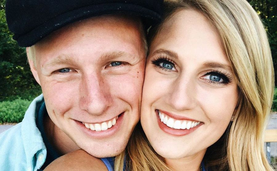 Ethan and Olivia take a picture together.