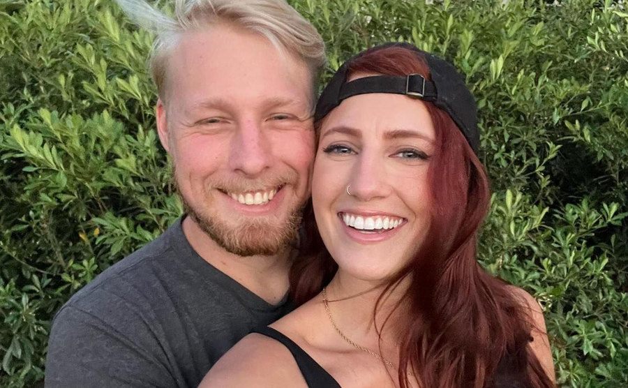 A photo of Ethan and Olivia smiling at the camera.