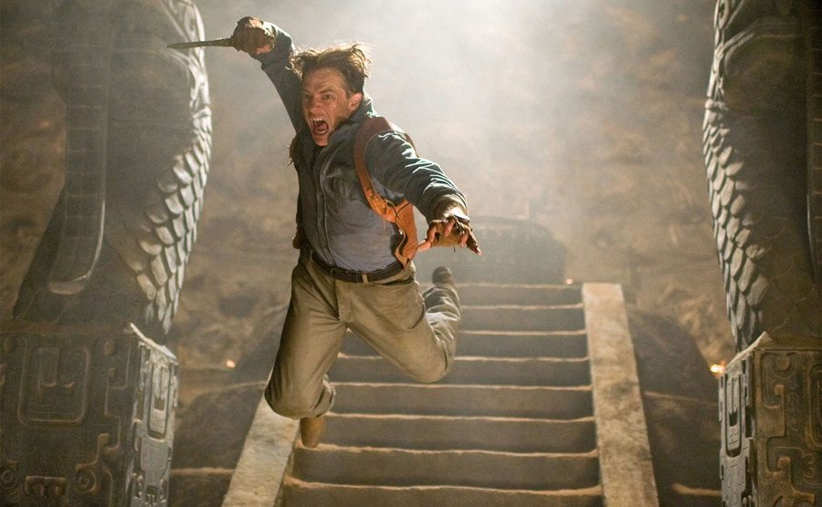Fraser leaps in a still from The Mummy: Tomb of the Dragon Emperor.