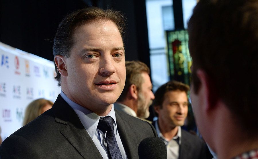 Fraser talks to the press at an event.
