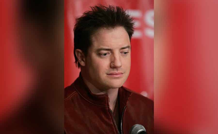 Brendan Fraser looks lost in thought.