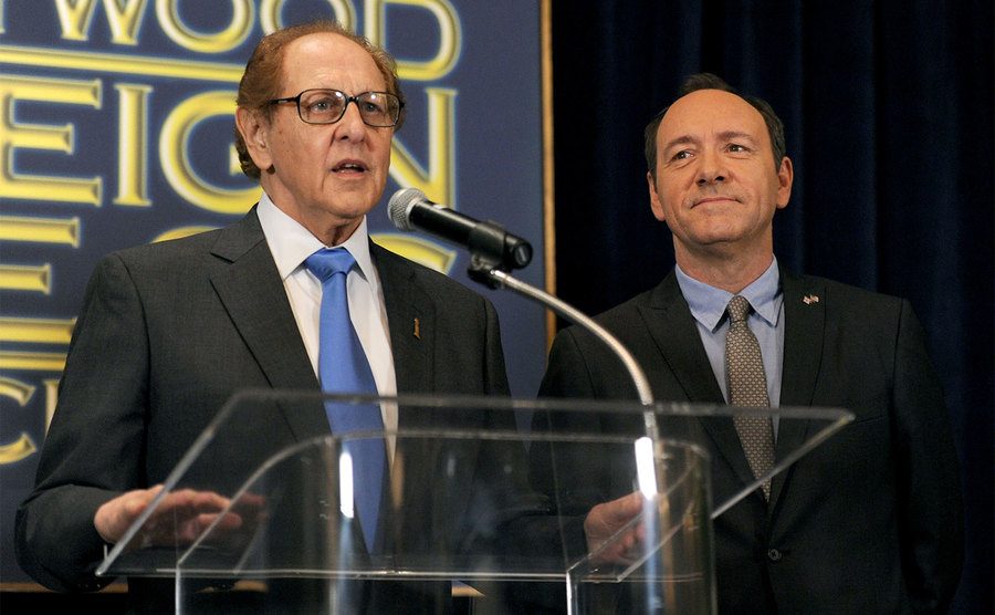 Philip Berk and actor Kevin Spacey speak onstage.