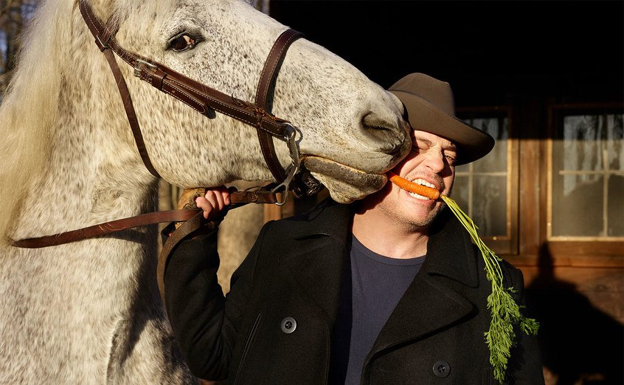 Fraser eats a carrot out of his horse’s mouth.