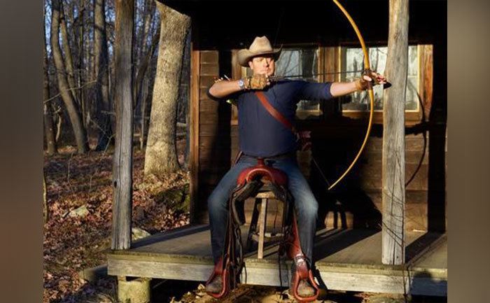 Fraser is practicing his archery.