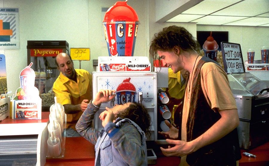 Pauly Shore drinks out of the slushy dispenser in a scene from the movie.