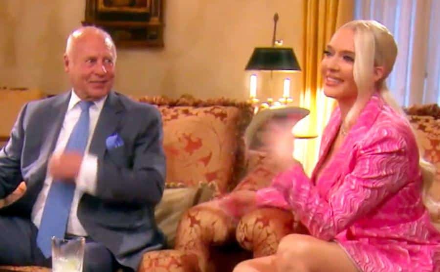 A still of Girardi and Erika sitting at home in an episode from reality tv.