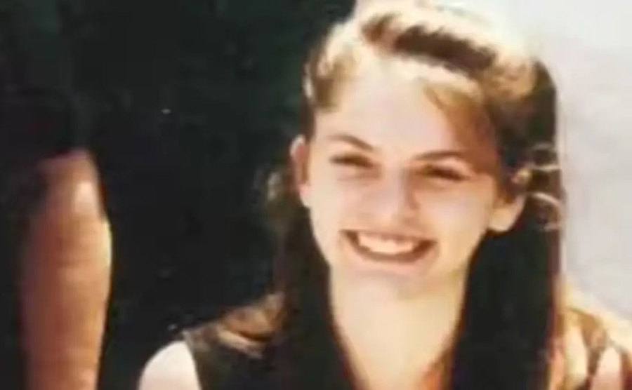 A dated picture of Jessica smiling at the camera.